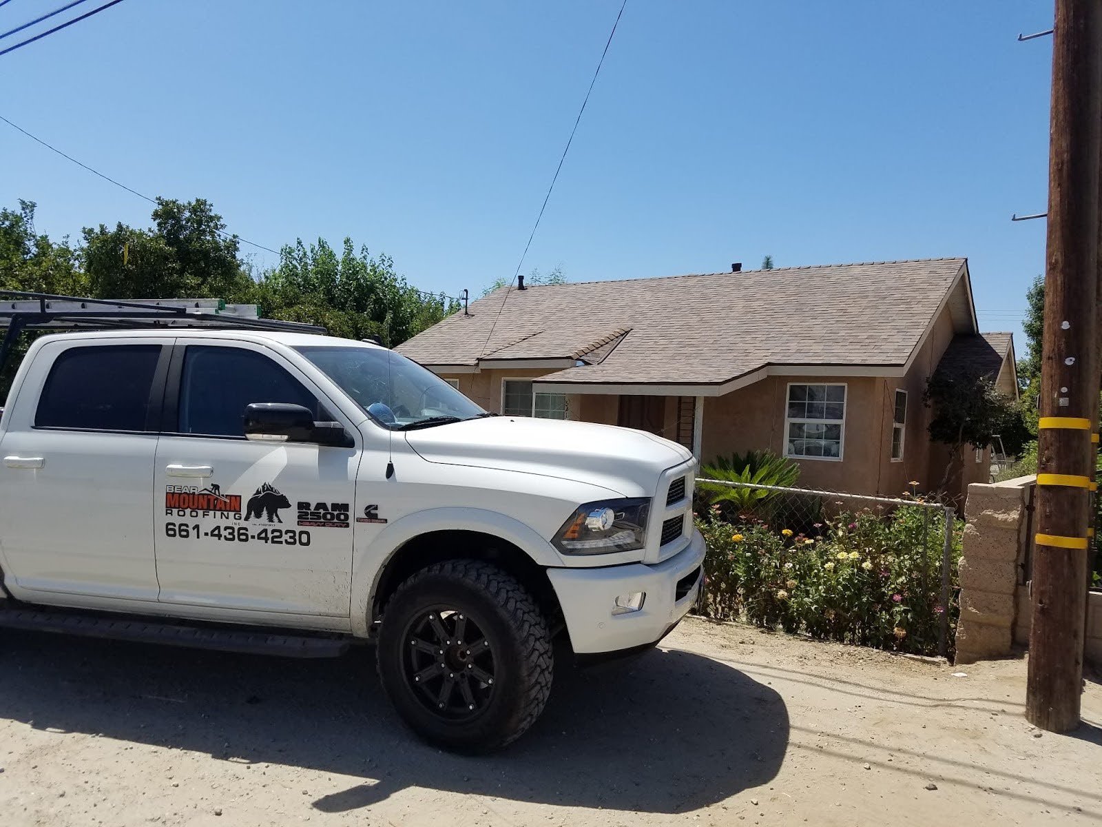truck branded with roofing logo, clean, and well-maintained